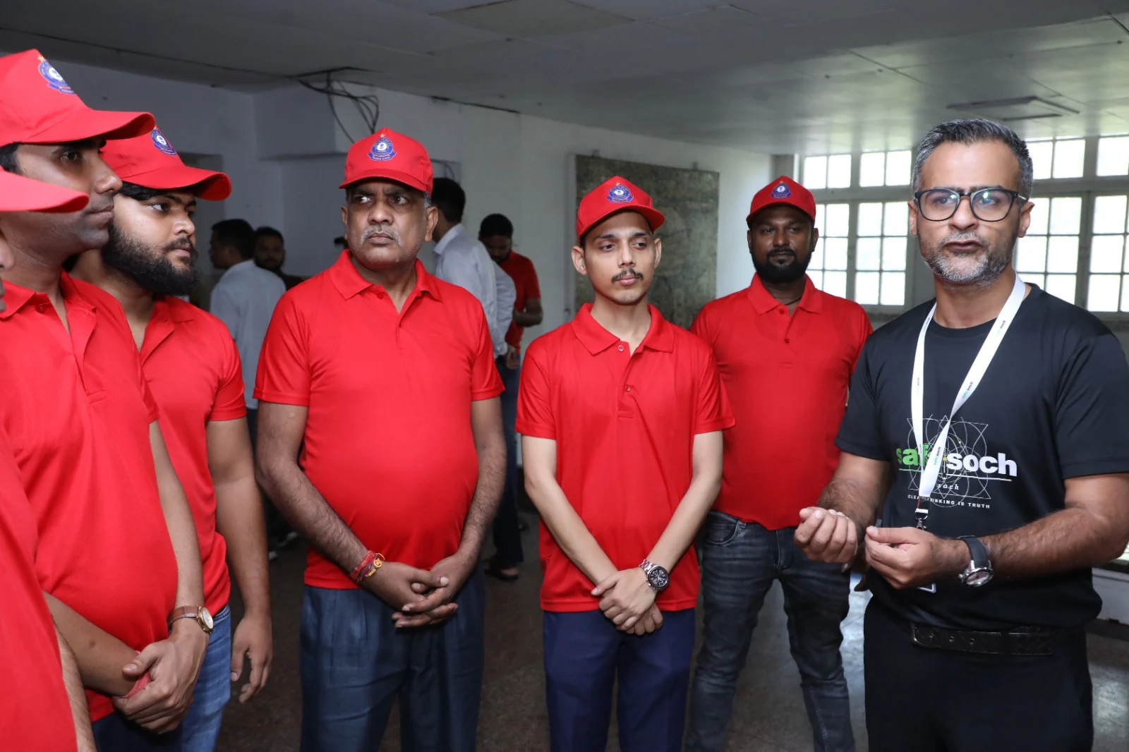 SafaSoch founder speaking with frontline cleaning staff during a practical training session